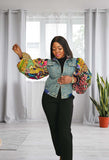 african american woman wearing a puffy sleeves jean jacket one hand up
